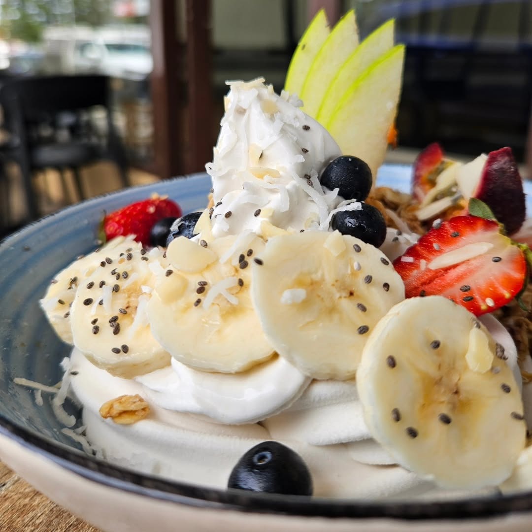 Breakfast bowl with banana, blueberries, granola and coconut