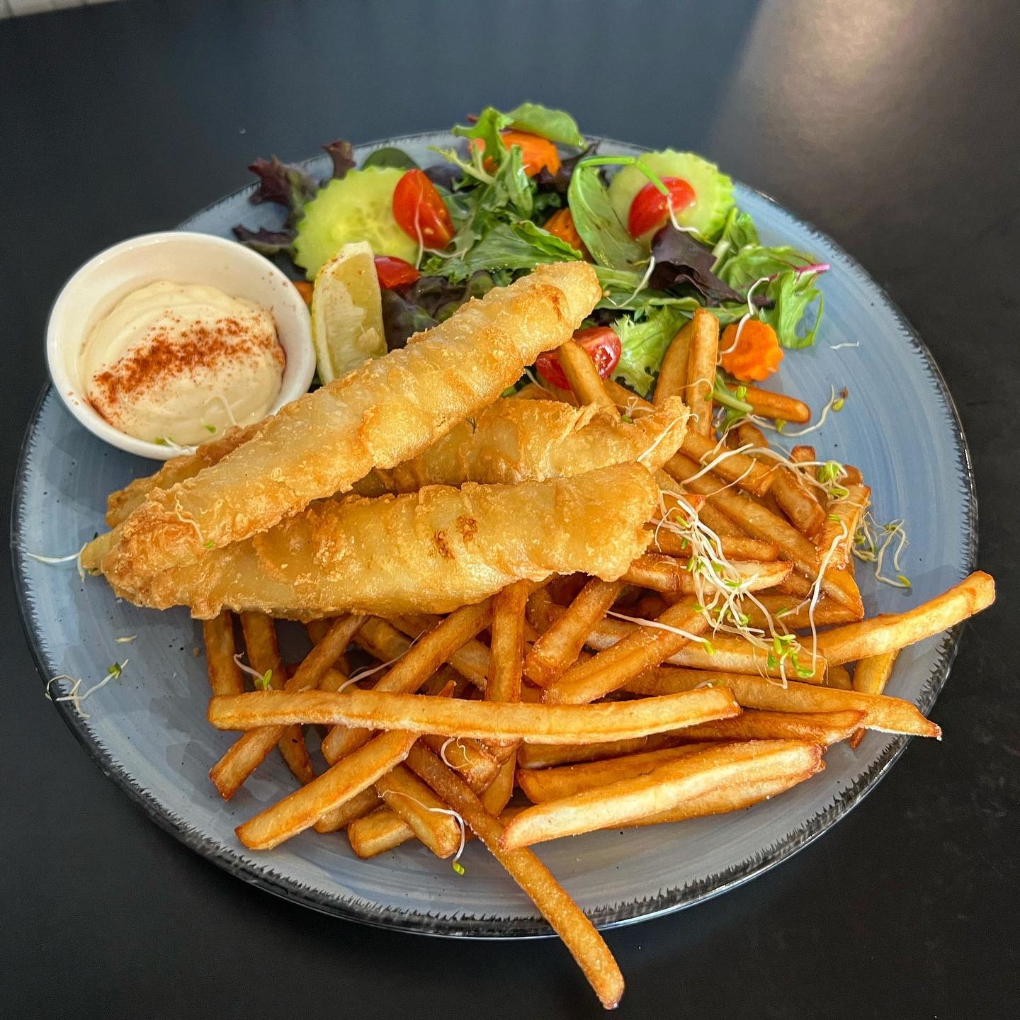Beer-battered fish and chips with garden salad and aioli