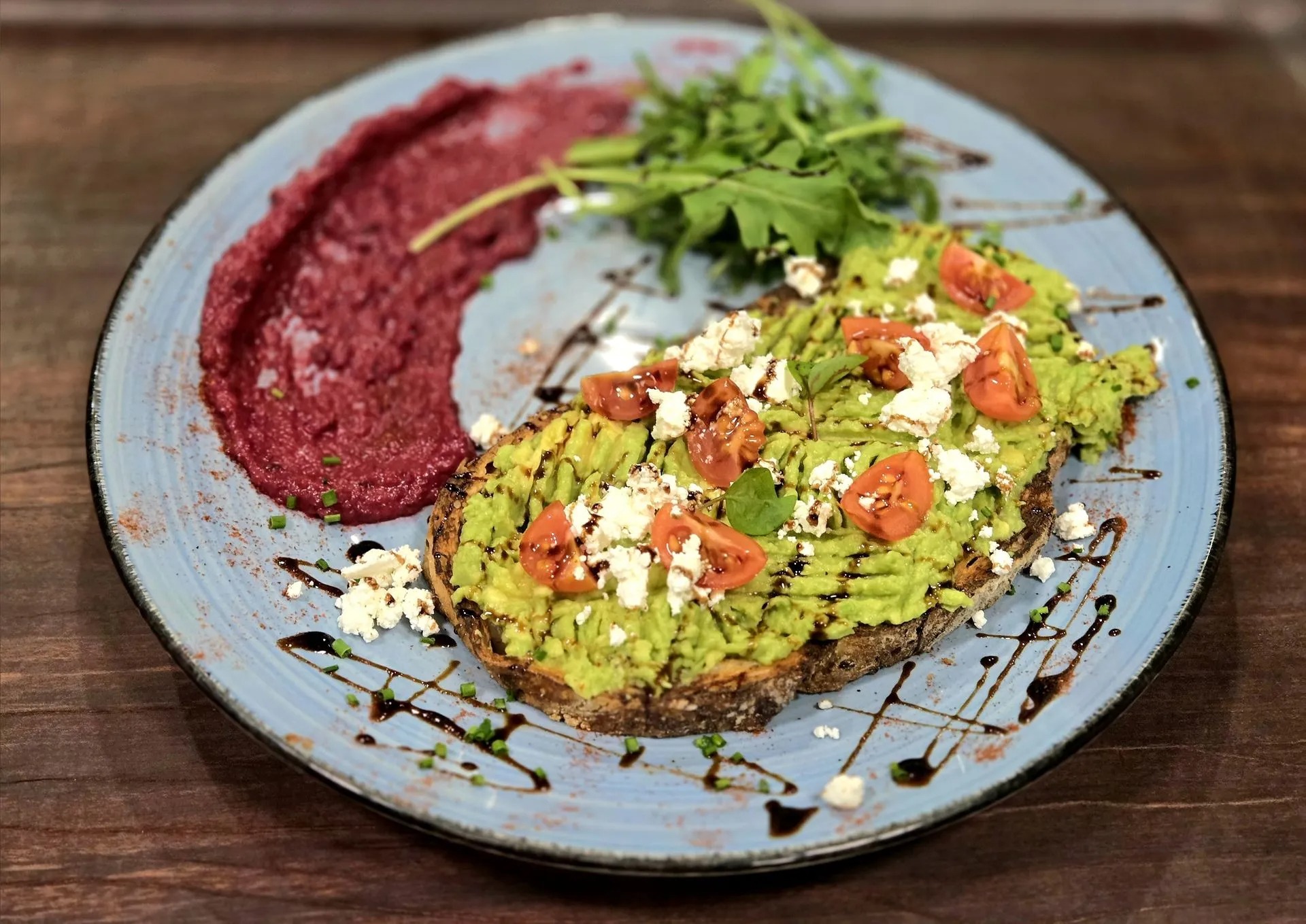 Fresh smashed avocado brunch plate at Alimento